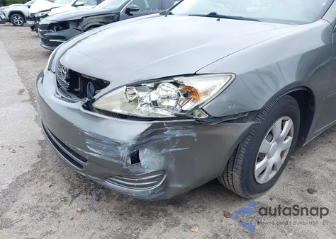 2003 Toyota Camry Le z USA, uszkodzony, nr VIN 4T1BE32K03U721258